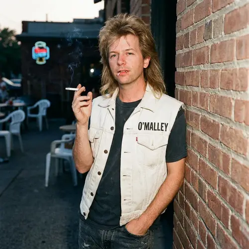 David Spade with Mullet and O'Malley Vest