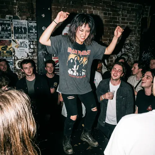 Rebellious Asian Female Dancing at Grungy Underground Club