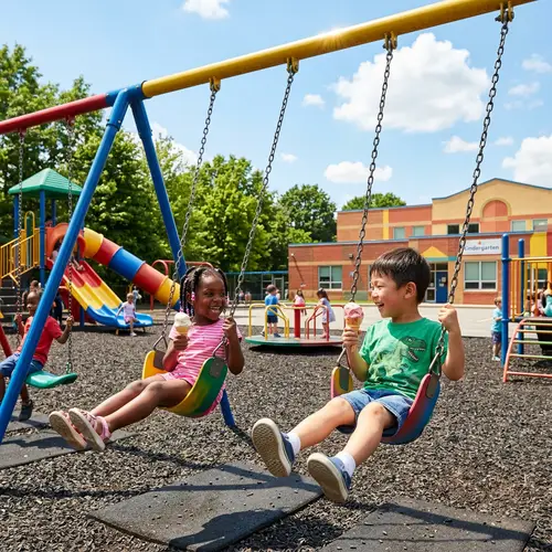 Kindergarten Swing Set: Boy and Girl Enjoying Ice Cream