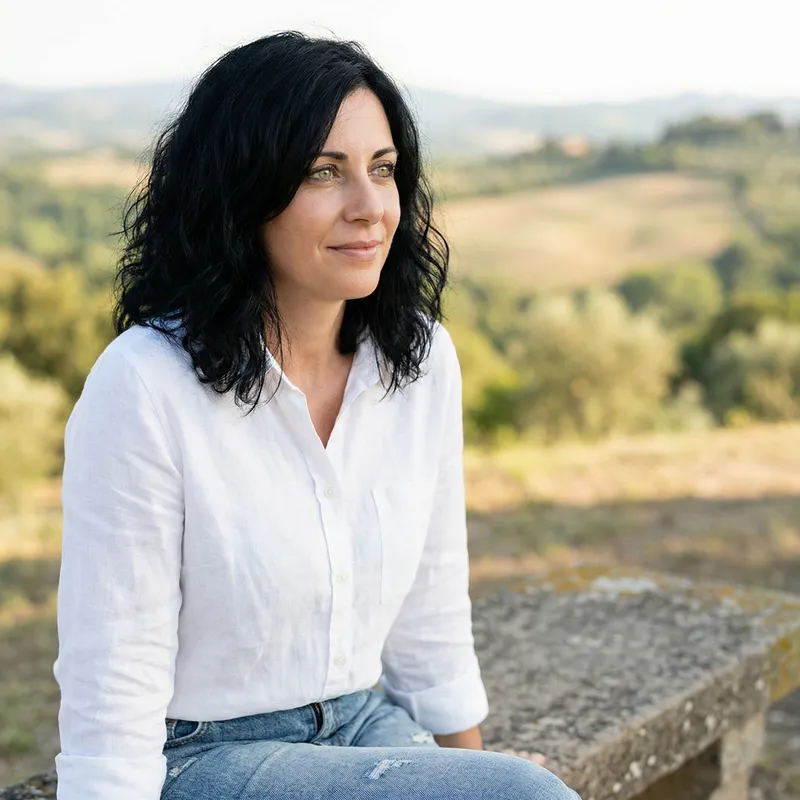 Captivating Woman with Green Eyes and Black Hair | Gazing Serenely in the Distance