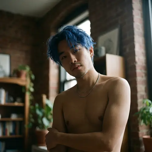 Blue-Haired Asian Man's Captivating Gaze | Website