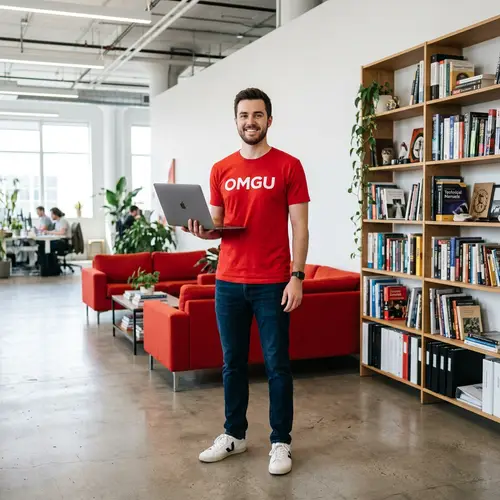 Young Programmer in Red Shirt with Laptop