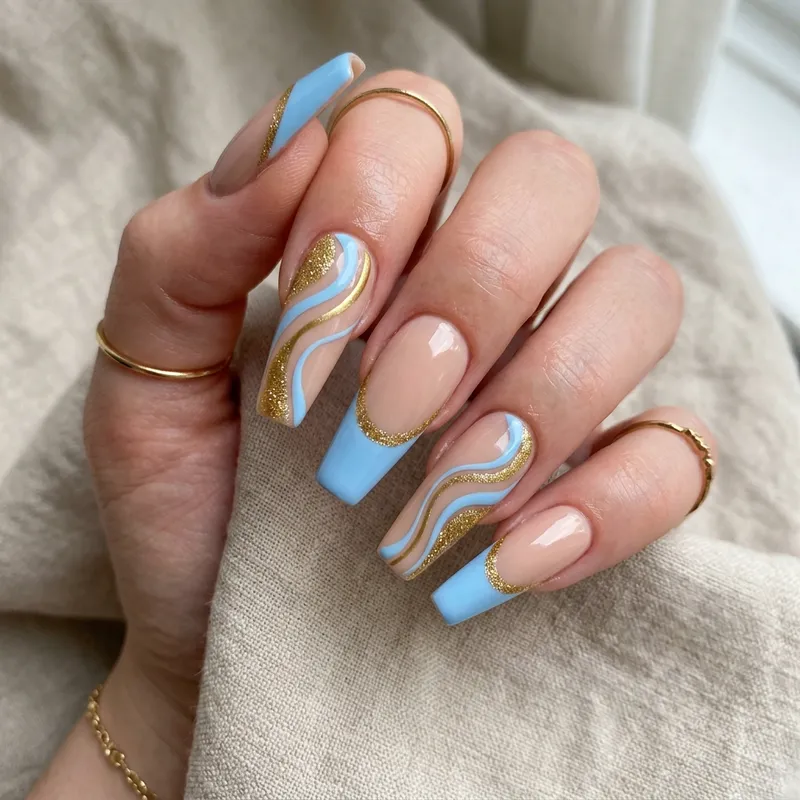 Stylish Coffin Nails with Blue and Gold Accents Stylish Coffin Nails with Blue and Gold Accents