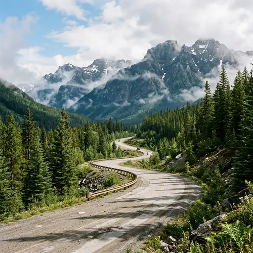 Scenic Serpentine Road Amid Majestic Mountains