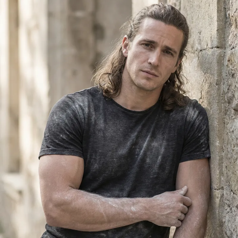 Aesthetically Pleasing Man with Flowing Brown Hair | Muscular, Chalky Appearance Aesthetically Pleasing Man with Flowing Brown Hair | Muscular, Chalky Appearance