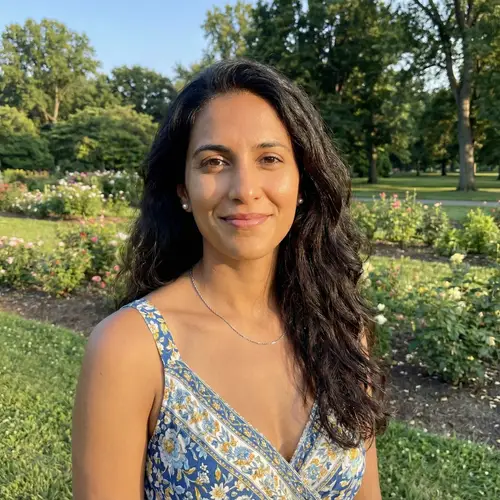 Graceful Woman in Chic Summer Dress with Pearl Earrings