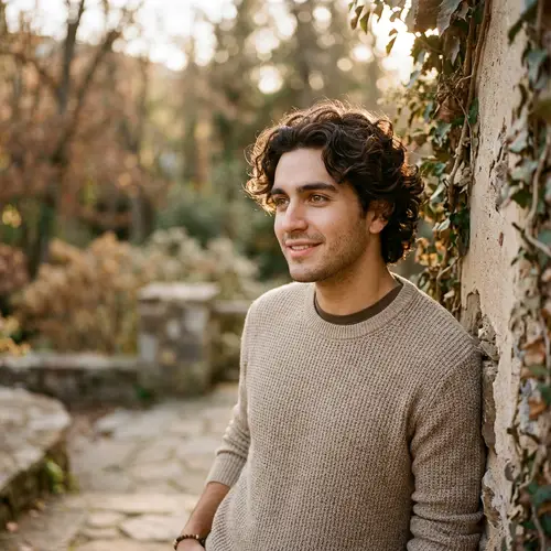 Young Hispanic Man with Curly Dark Brown Hair and Brown Eyes