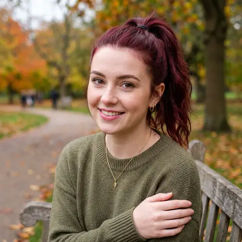 20-Year-Old Woman with Maroon Hair and Brown Eyes