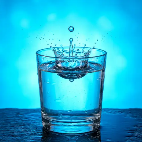 Captivating Water Drop in Vibrant Blue Glass