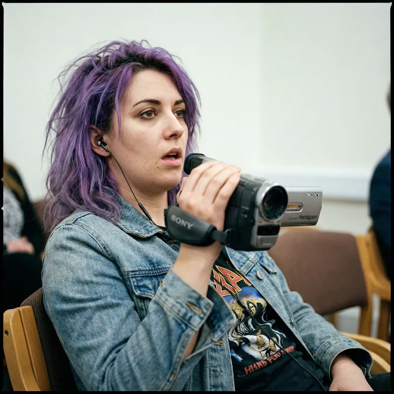 Creative Video Production: Woman with Purple Hair Filming
