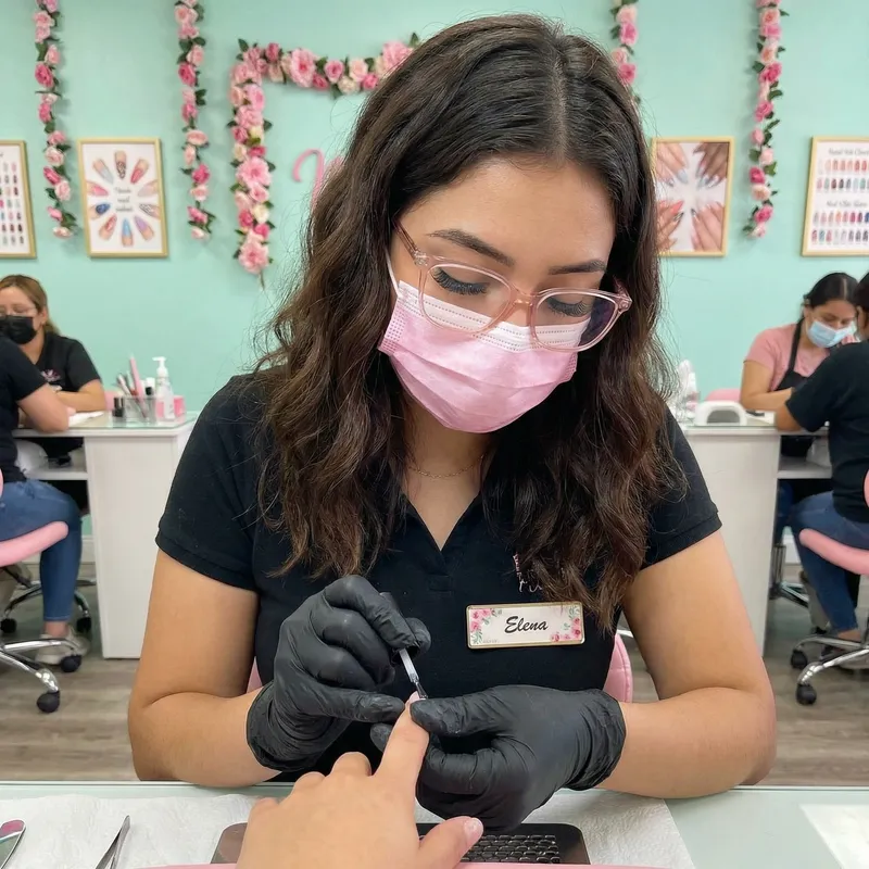 Young Hispanic Woman Manicurist with Tan Skin and Pink Accents