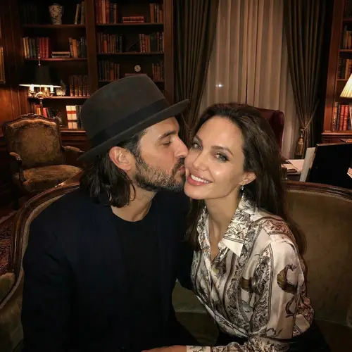 Elegant Couple Kissing in Stylish Setting