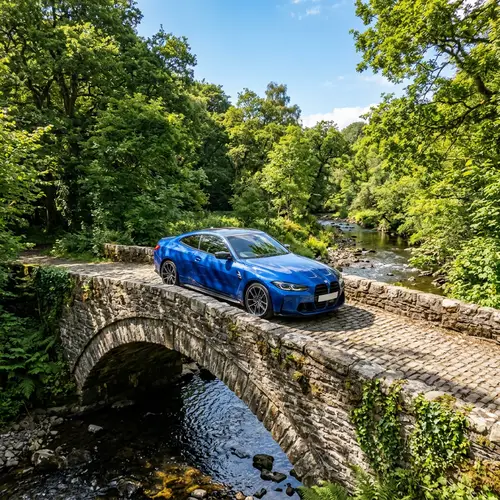 Sleek BMW Car on Tranquil Stone Bridge