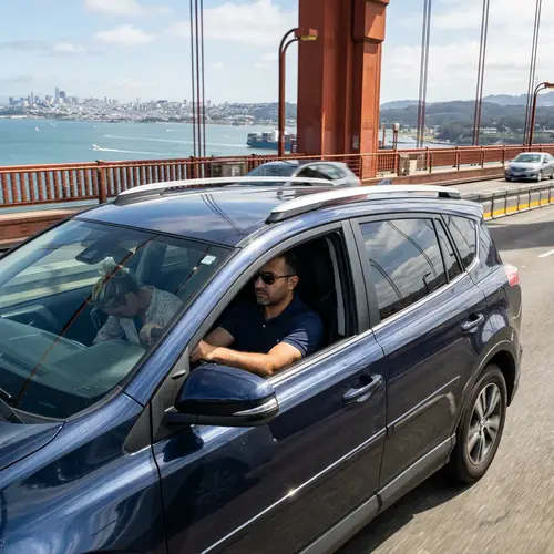 Candid Moment: Man and Woman in Car Crossing Bridge