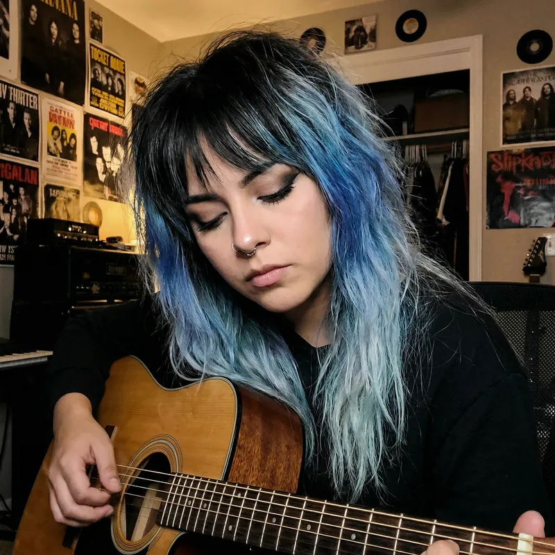 Hispanic Emo Woman with Shaggy Blue Ombre Hair Playing Guitar