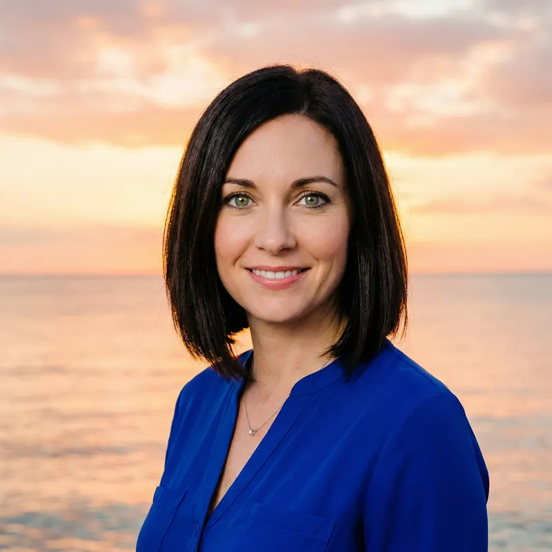 Portrait of Woman with Dark Bob Hair and Striking Green Eyes