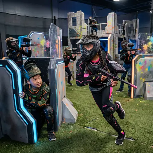 Kids Playing Paintball in a High-Tech Arena