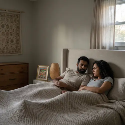 Intimate Moment: Couple in Bedroom Sharing Sadness