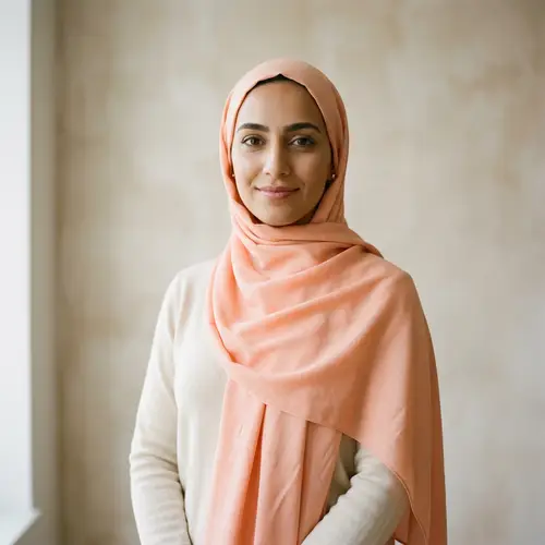 Serene Middle-Eastern Woman in Peach-colored Hijab